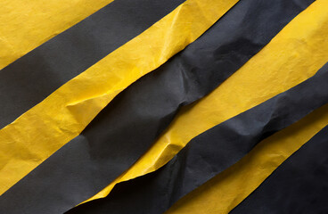 Stacked yellow and black wrinkled or crumpled paper forms an unusual background.