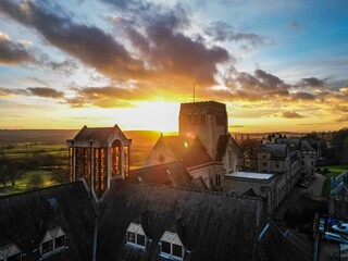 Drone shot of the roofs of big houses and the Ampleforth Abbey in the UK at sunset