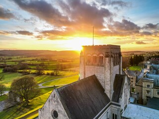 Drone shot of the roofs of big houses and the Ampleforth Abbey in a UK at sunset - obrazy, fototapety, plakaty