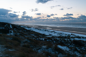 Sunset at a frozen Belgian coast
