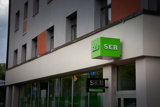RIGA, LATVIA - AUGUST 21, 2023: SEB bank logo on their local office in Riga. SEB, or Skandinaviska Enskilda Banken is a Swedish retail banking institution spread in Baltic states.