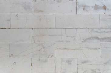 Marble wall brick stone texture detailed cracks pattern background pale warm grey color