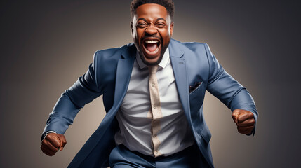 Fototapeta premium super positive young man of African-American appearance office worker laughs from a job well done in a large office