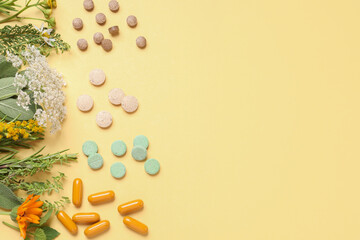 Different pills, herbs and flowers on light yellow background, flat lay with space for text....