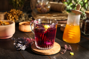 Aromatic herbal tea, dry lavender and honey on wooden table