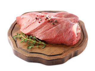 Piece of raw beef meat with spices and thyme isolated on white