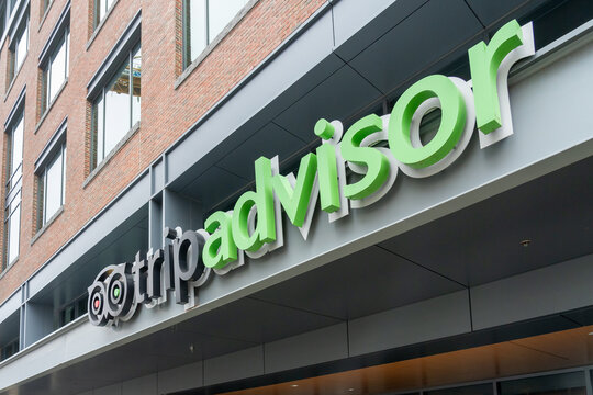 TripAdvisor Logo Sign On Its Headquarters Building In Needham, MA, USA. November 9, 2023. Tripadvisor Is A Travel Guidance Platform. 