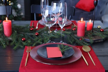 Elegant Christmas table setting with blank place card and festive decor