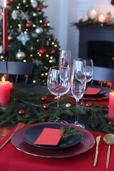 Elegant Christmas table setting with blank place cards and festive decor