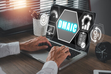 DMAIC, Define, Measure, Analyze, Improve and Control concept, Businessman using laptop computer on...