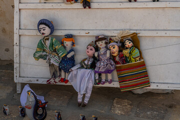 Dolls dressed in traditional uzbek costumes. Traditional souvenir puppet