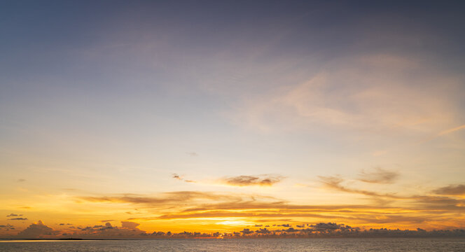 Abstract amazing Scene of stuning Colorful sunset or sunrise with clouds background in nature and travel concept, wide angle shot Panorama shot,Copy space.