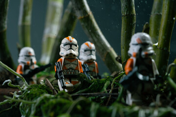 Obraz premium Depok, Indonesia - November 2, 2023: Lego toys photography, 212th clone troopers on swamp forest, bokeh background