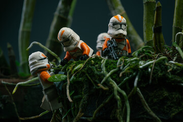Fototapeta premium Depok, Indonesia - November 2, 2023: Lego toys photography, 212th clone troopers on swamp forest, bokeh background