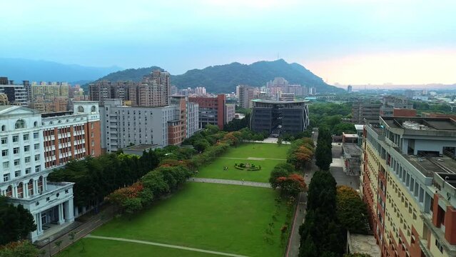 Aerial 4K footage of National Taipei University during sunset. A prestigious university specialized in business and law located in Sanxia District, New Taipei City, Taiwan.