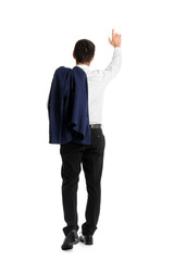 Young businessman walking away on white background, back view