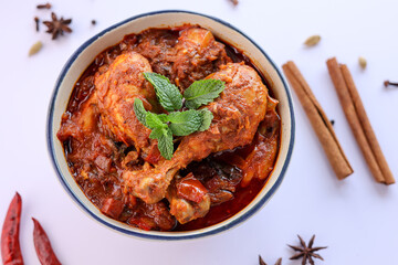 Spicy red chicken curry. Goan style chicken vindaloo. Butter chicken Murgh Makhani curry roast hot and spicy gravy dish Dhaba Punjab, India. North Indian non-vegetarian cuisine Garam Masala. tikka