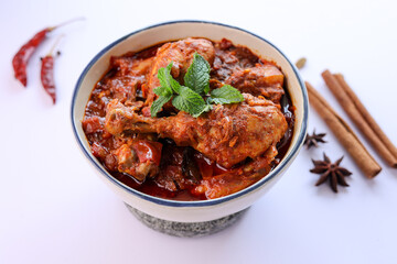 Spicy red chicken curry. Goan style chicken vindaloo. Butter chicken Murgh Makhani curry roast hot and spicy gravy dish Dhaba Punjab, India. North Indian non-vegetarian cuisine Garam Masala. tikka