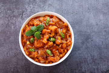 Gobi Manchurian curry gravy, Gobi 65, chilly gobi or cauliflower fry. Popular street food of India made of cauliflower florets Mumbai India.