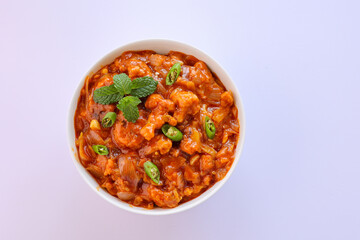 Gobi Manchurian curry gravy, Gobi 65, chilly gobi or cauliflower fry. Popular street food of India made of cauliflower florets Mumbai India.