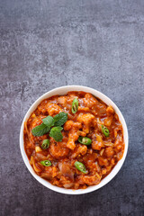 Gobi Manchurian curry gravy, Gobi 65, chilly gobi or cauliflower fry. Popular street food of India made of cauliflower florets Mumbai India.