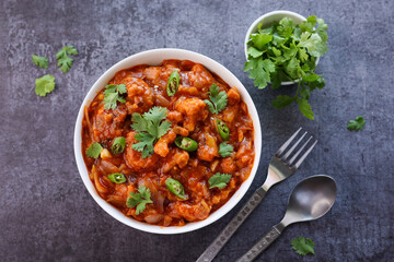 Gobi Manchurian curry gravy, Gobi 65, chilly gobi or cauliflower fry. Popular street food of India made of cauliflower florets Mumbai India.