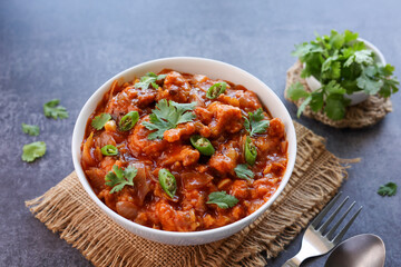 Gobi Manchurian curry gravy, Gobi 65, chilly gobi or cauliflower fry. Popular street food of India made of cauliflower florets Mumbai India.