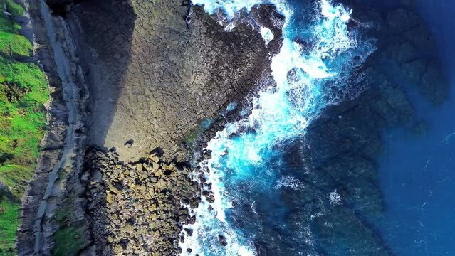Top down 4k footage of Bitoujiao, a famous scenery of Taiwan northeast corner. Birds eye view in Bitoujiao cape, Ruifang district, New Taipei, Taiwan.