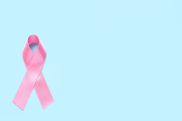 Pink ribbon on blue background. Breast cancer awareness concept