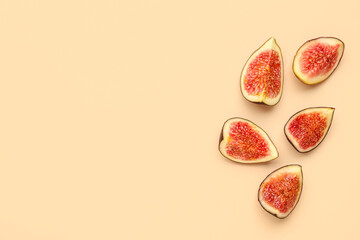 Pieces of fresh ripe figs on orange background