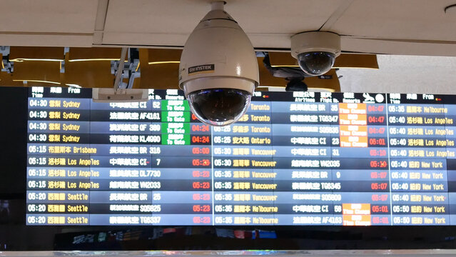 Close up of security camera in front of flight schedules board inside Taoyuan international airport in Taoyuan Taiwan