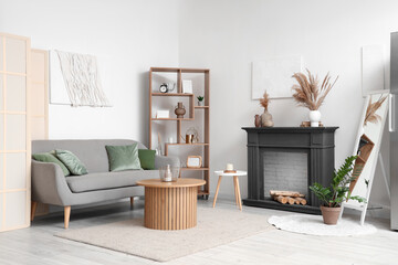 Interior of living room with decorative fireplace and sofa