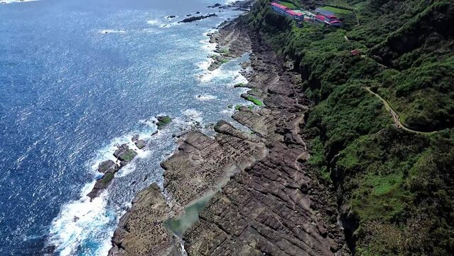 Aerial 4k footage of Bitoujiao, a famous scenery of Taiwan northeast corner. Birds eye view in Bitoujiao cape, Ruifang district, New Taipei, Taiwan.