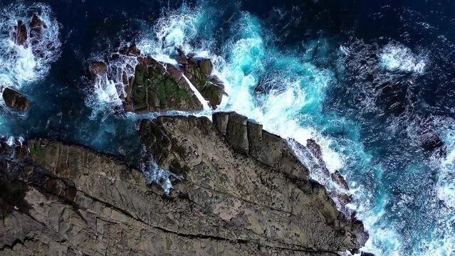 Top down 4k footage of Bitoujiao, a famous scenery of Taiwan northeast corner. Birds eye view in Bitoujiao cape, Ruifang district, New Taipei, Taiwan.