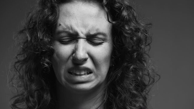 Woman Showing Strong Disgust, Intense Aversion Emotion, Dramatic Monochrome Close-up