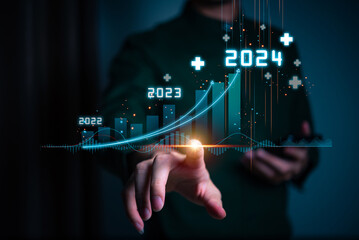 Businessman forecste analyze graph corporate future growth year 2024. New Goals with Plans and...