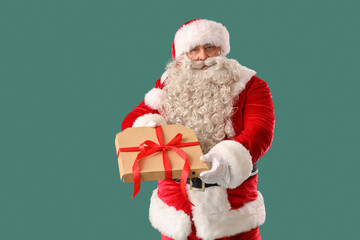 Santa Claus with tasty pizza on green background