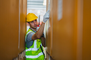 Professional worker in safety uniform hard hat, supervisor inspector packaging stock order at factory warehouse, piles of stacking paper manufacture, recycling production industry.