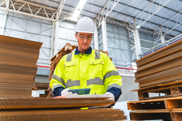 Professional worker in safety uniform hard hat, supervisor inspector packaging stock order at...