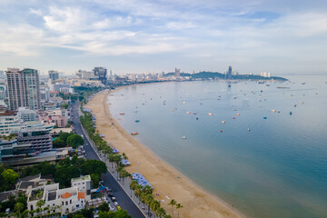 Pattaya Thailand, a view of the beach road with hotels and skyscrapers buildings alongside the renovated new beach road with palm trees