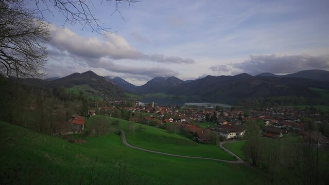 View of mountains and mountain lake in summer. Beautiful town of Schliersee in Bavaria, Germany, Europe. Lake Schliersee in bavarian mountain range. Upper Bayern. Panarama auf den Schliersee. 