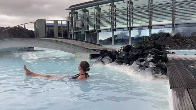 Young female model chilling inside Blue Lagoon geothermal spa