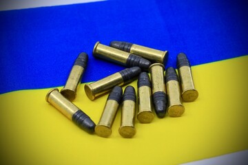 Bullets for wartime on a Ukrainian national flag 