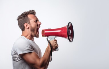Side view of a man shouting into a loudspeaker - obrazy, fototapety, plakaty