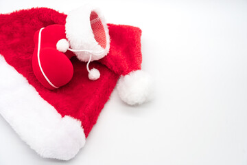 Santa's boot on Santa Claus red hat isolated on white background. Christmas background.