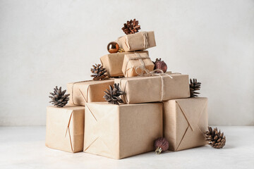 Pine cones with many gift boxes and Christmas balls on white background