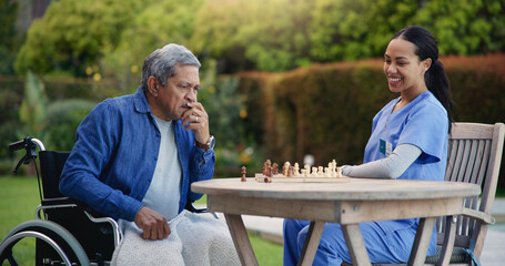 Happy woman, nurse and senior playing chess in nature for elderly care, match or thinking in...