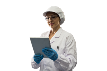 Portrait of female medical scientist wearing uniform, hairnet, gloves and working with digital tablet on white background