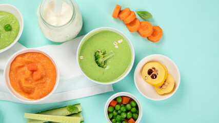 Bowls with different healthy baby food.