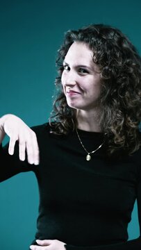 Excited Woman Gesturing with Hand, Expressing "Oh La La" and "Oof" Emotion, Positive Anticipation